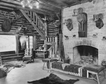 Interior shot of the game room of the Paradise cabin showing Gilbert's trophy heads.