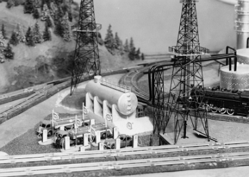 Area to left of oil refinery . The switch at the left is a prototype of a streamlined switch design for tight locations. Note the absence of a motor housing and a narrow base profile.