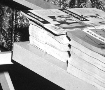 This enlarged view taken from the previous photo shows a pile of catalogs which are from 1963.