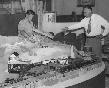1948 Display - C. Al Joy, Sales Manager for Trains preparing an Exhibit for the Eastern States Exposition. Other individual may be builder Glen Roxor Short who later worked on the large 1st floor layout.